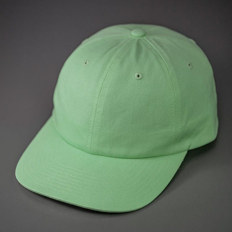 A Patina Green, Premium Cotton, 6 Panel Crown, Blank Dad Hat.  Designed by Blvnk Headwear.