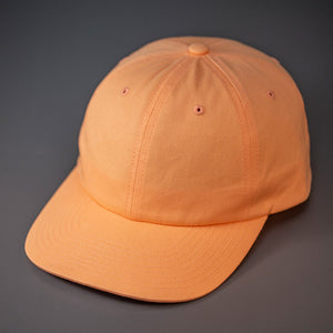 A Peach Colored, Premium Cotton, 6 Panel Crown, Blank Dad Hat.  Designed by Blvnk Headwear.
