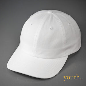 A Youth Sized, White, Premium Cotton, 6 Panel Crown, Blank Dad Hat.  Designed by Blvnk Headwear.