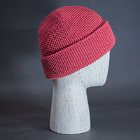 The Waffle Beanie, a coral colored, waffle knit blank beanie. Designed by Blvnk Headwear.