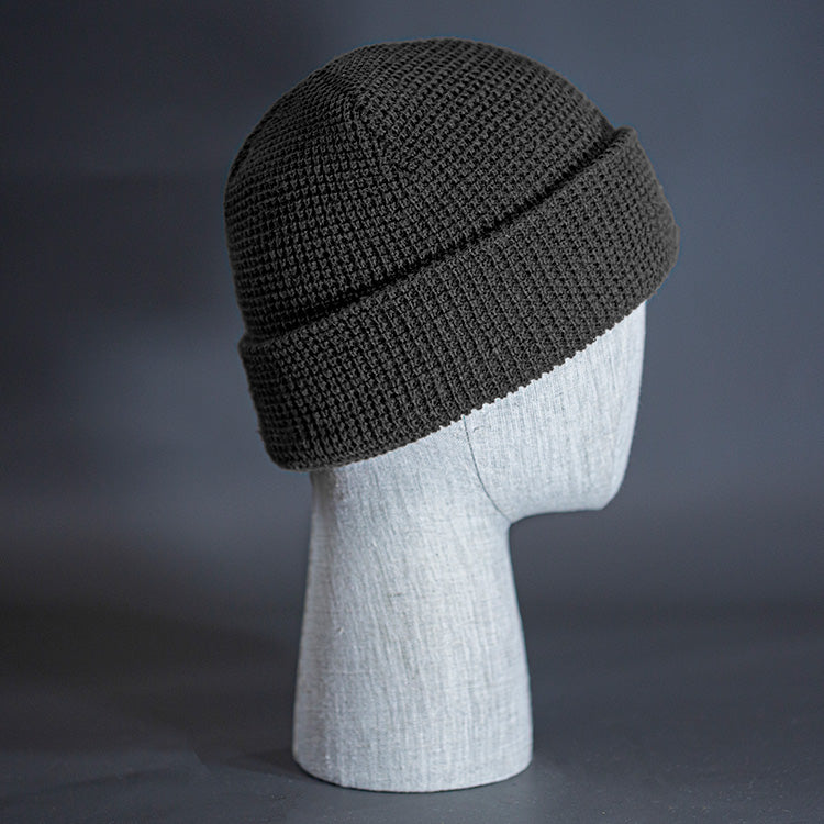 The Waffle Beanie, a heather charcoal colored, waffle knit blank beanie. Designed by Blvnk Headwear.