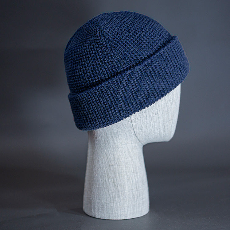 The Waffle Beanie, a navy colored, waffle knit blank beanie. Designed by Blvnk Headwear.