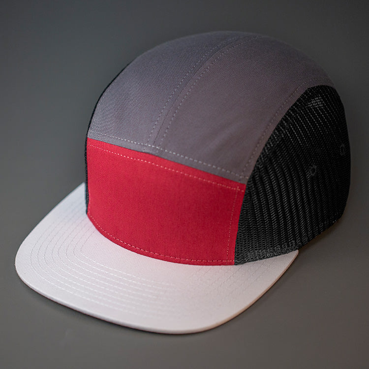 A Cardinal, Dark Grey, Black & White, Cotton Twill/Mesh, Blank 5 Panel Camp Trucker Hat With a Flat Bill, & Woven Nylon Strapback.  Designed by Blvnk Headwear.